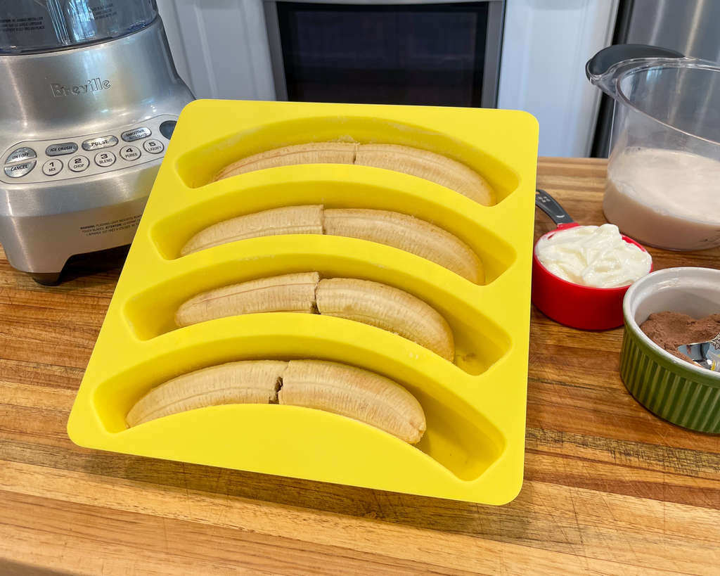 Silicone freezer tray on the counter full of bananas