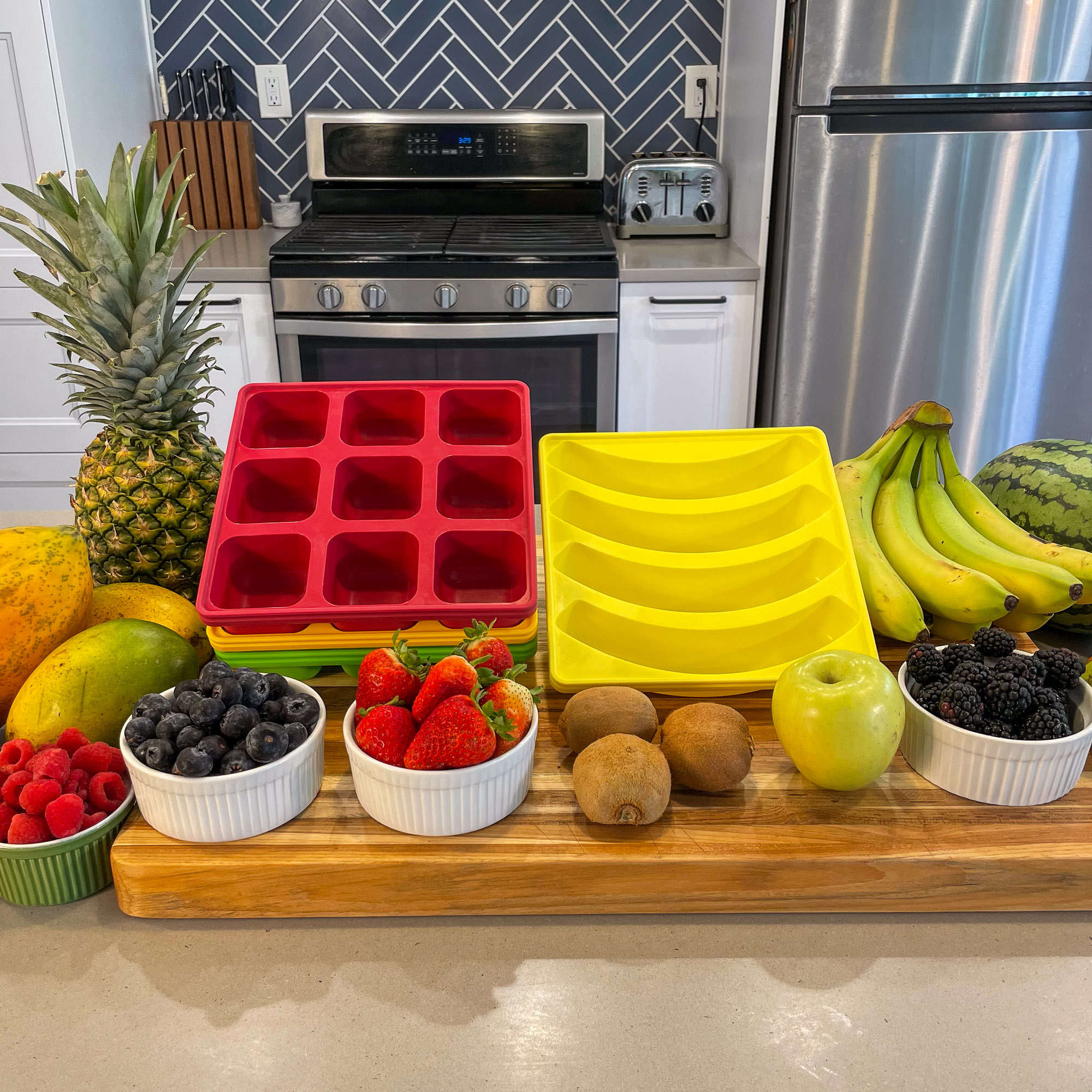 Image of Smootheeze freezer trays surround by fresh fruits and veggies for freezing.