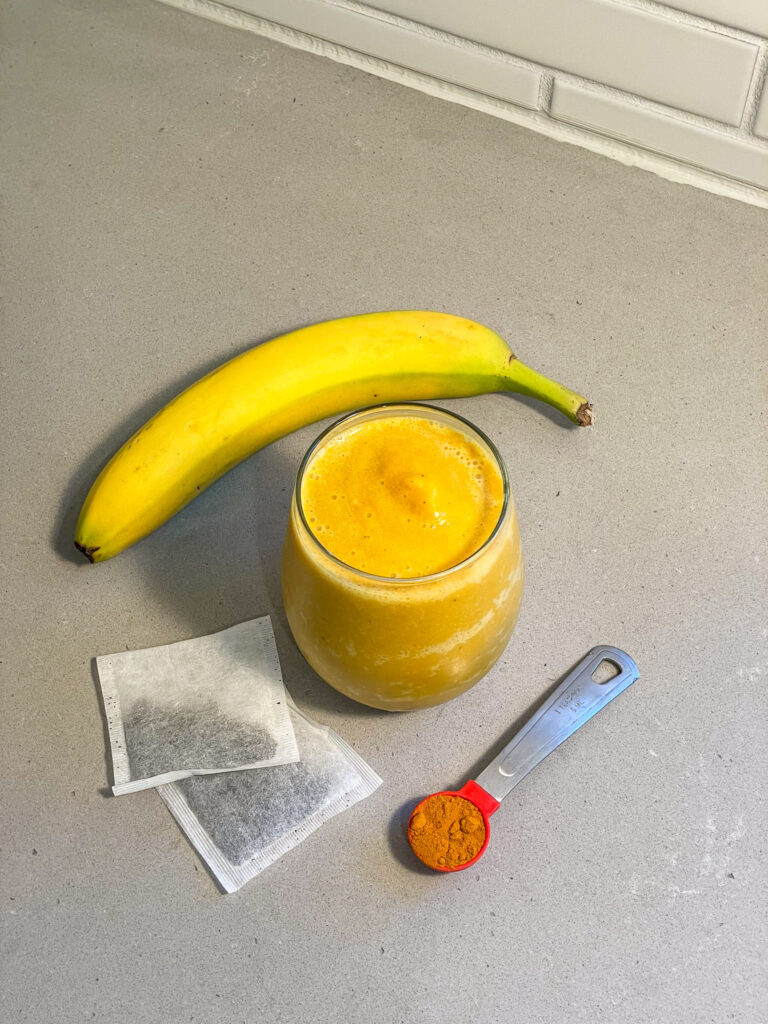 Golden Chai smoothie in a glass on the counter