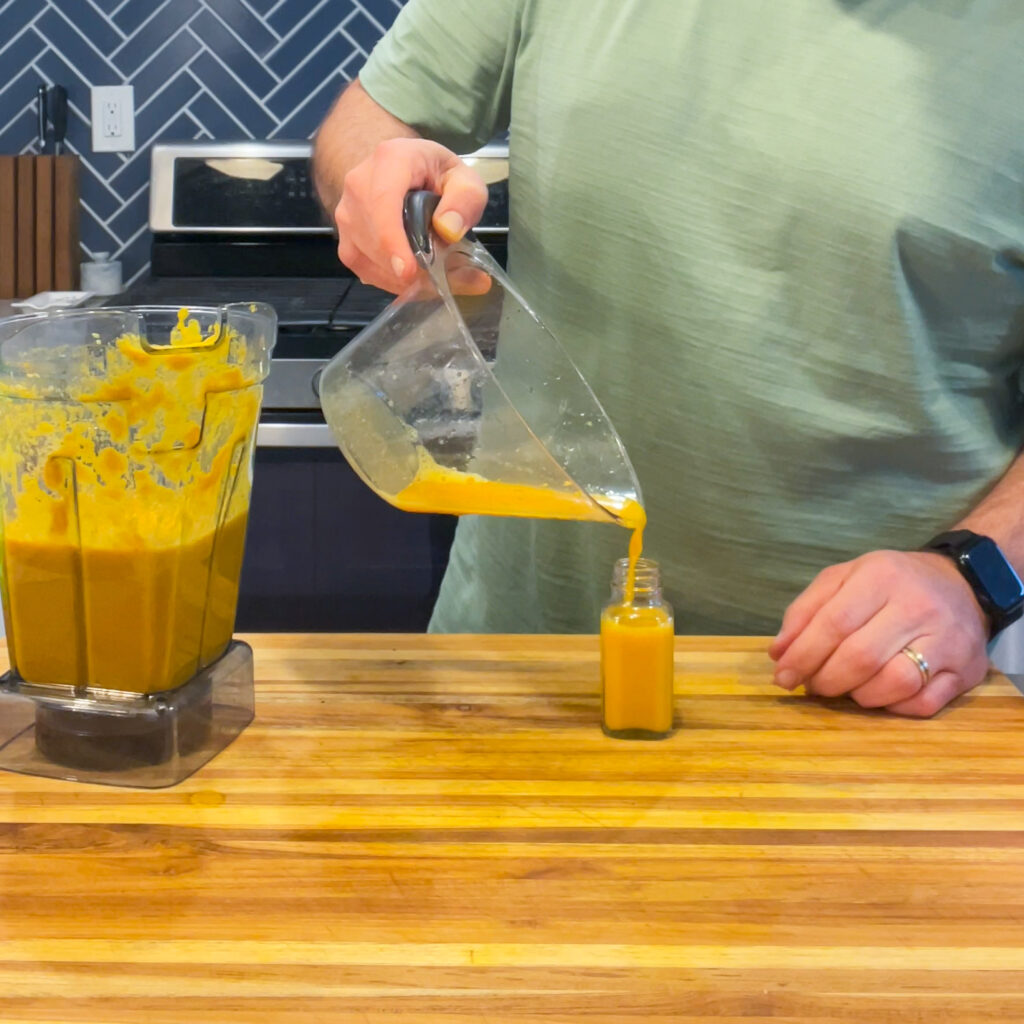 Pouring immunity shot liquid into a small bottle