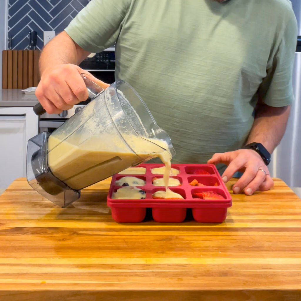 Pouring Immunity Shot Liquid into a Smootheeze Tray.