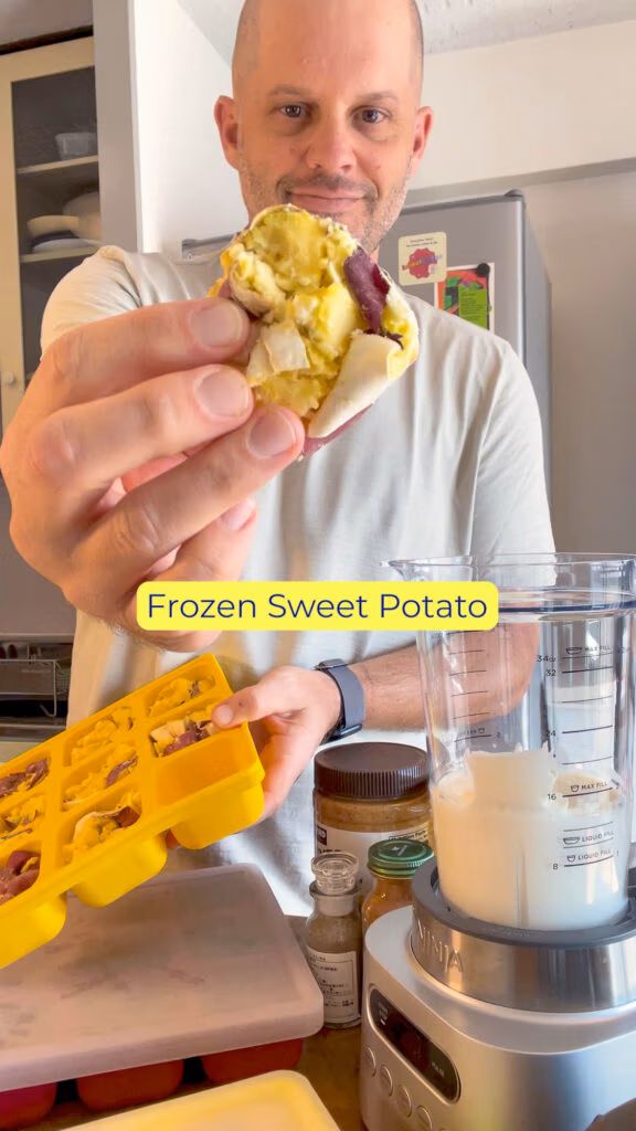 Cube of frozen sweet potato being pulled from a Smootheeze freezer tray