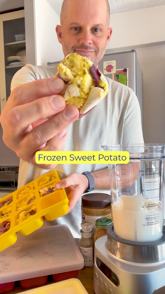 Cube of frozen sweet potato being pulled from a Smootheeze freezer tray